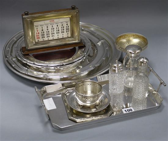 A quantity of plated wares including a desk calendar largest diameter 40cm